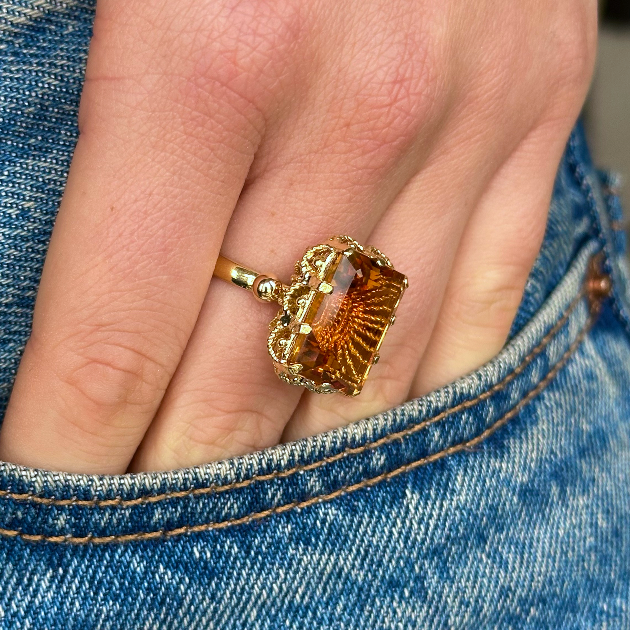 Antique, 1880s Citrine Ring with Rope Metal Work, worn on hand in pocket of jeans.