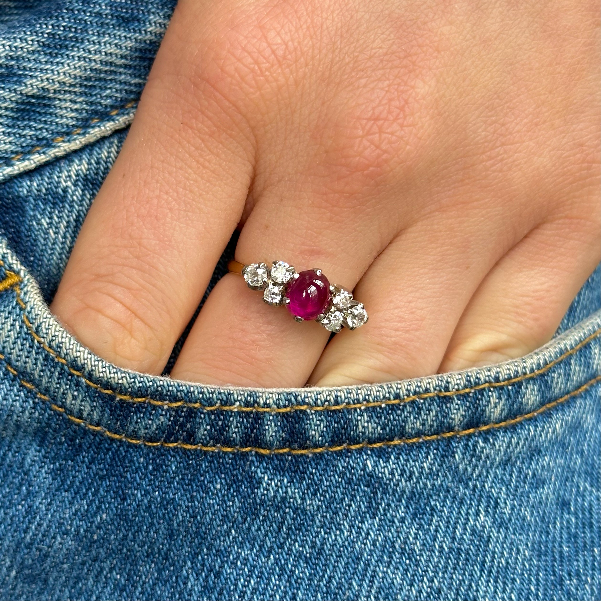 Antique, Edwardian Cabochon Ruby and Diamond Ring, worn on hand in pocket of jeans.