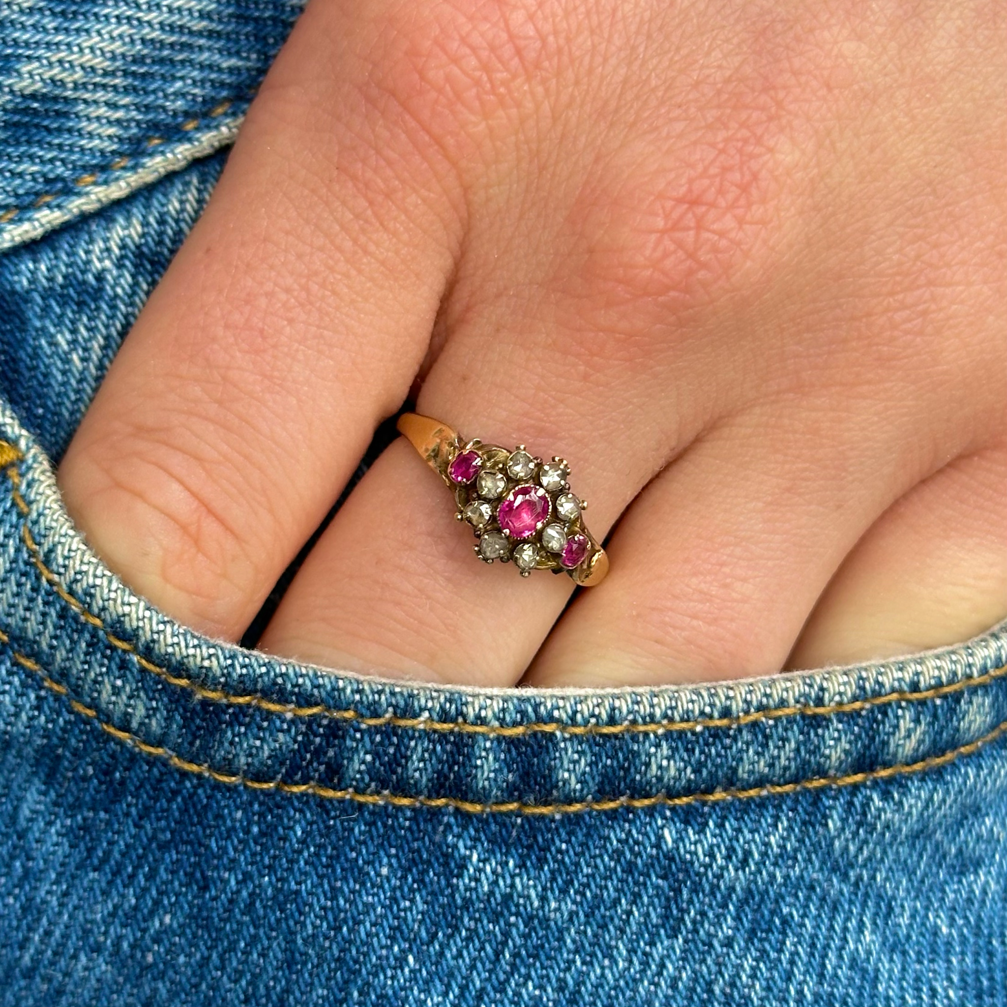 Antique, Edwardian Ruby and Diamond Cluster Ring, worn on hand in pocket of jeans