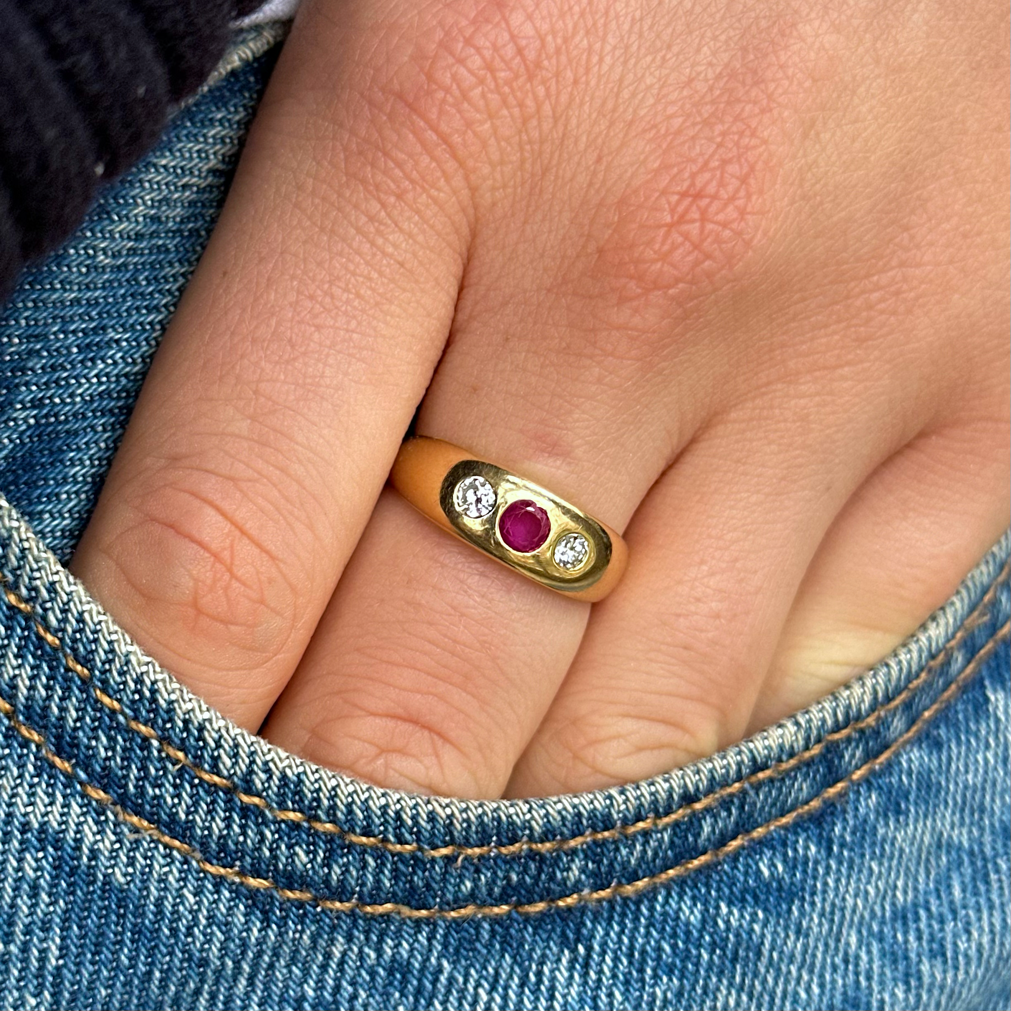 Antique, Edwardian Ruby and Diamond Gypsy Ring, worn on hand placed in pocket of jeans