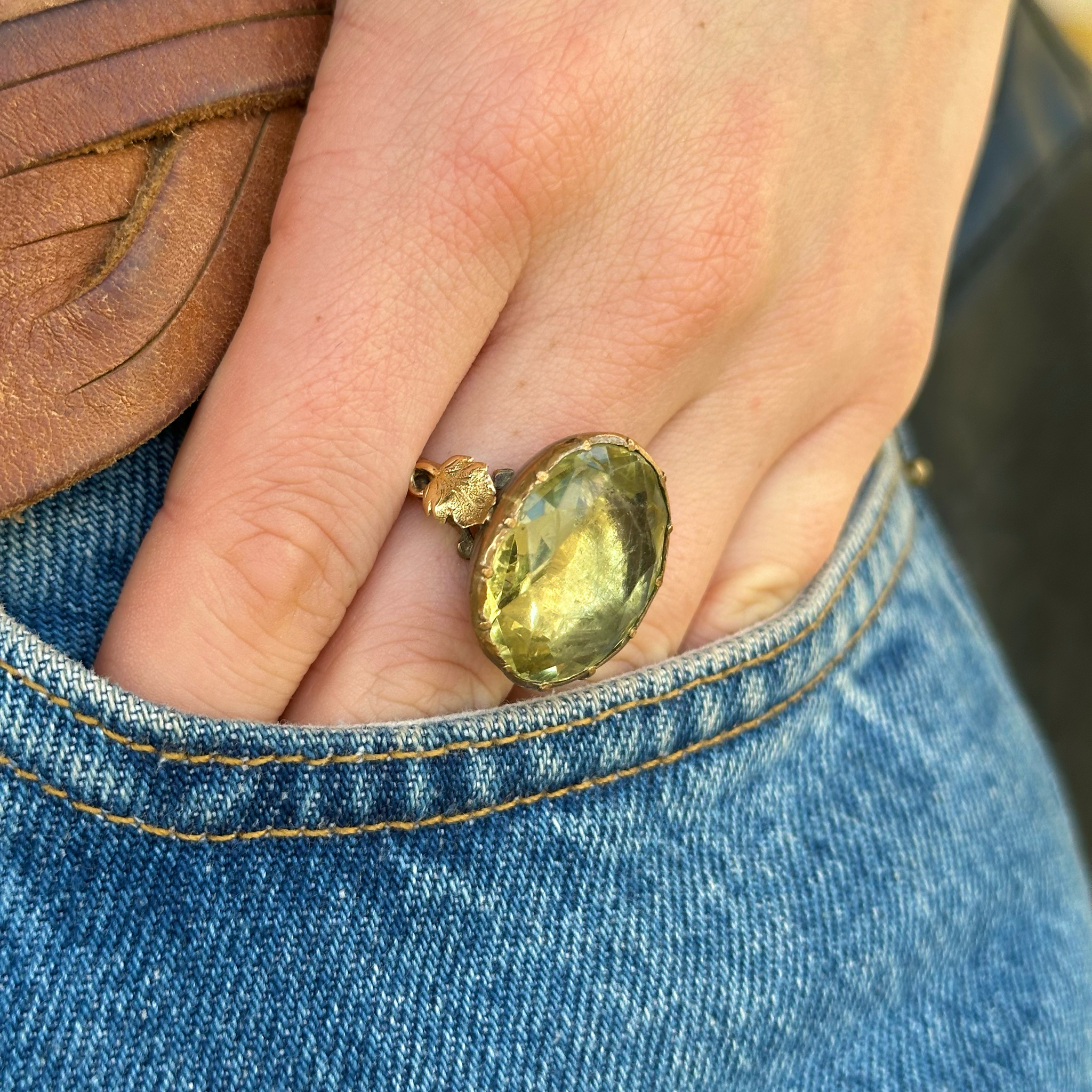 Antique Georgian green paste cocktail ring, worn on hand in pocket of jeans