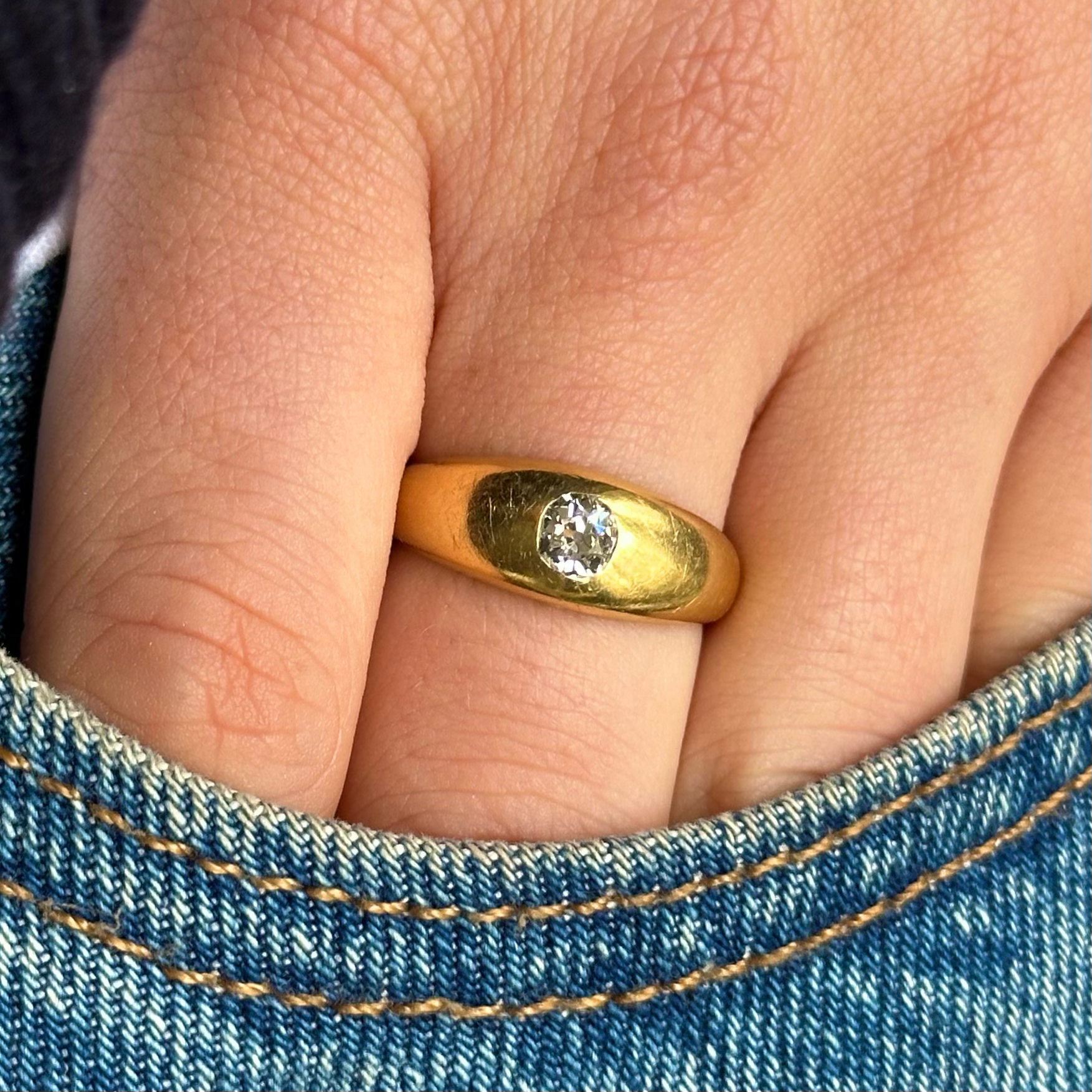 Antique, Single-Stone Diamond Gypsy Ring, 18ct Yellow Gold worn on hand in pocket of jeans.