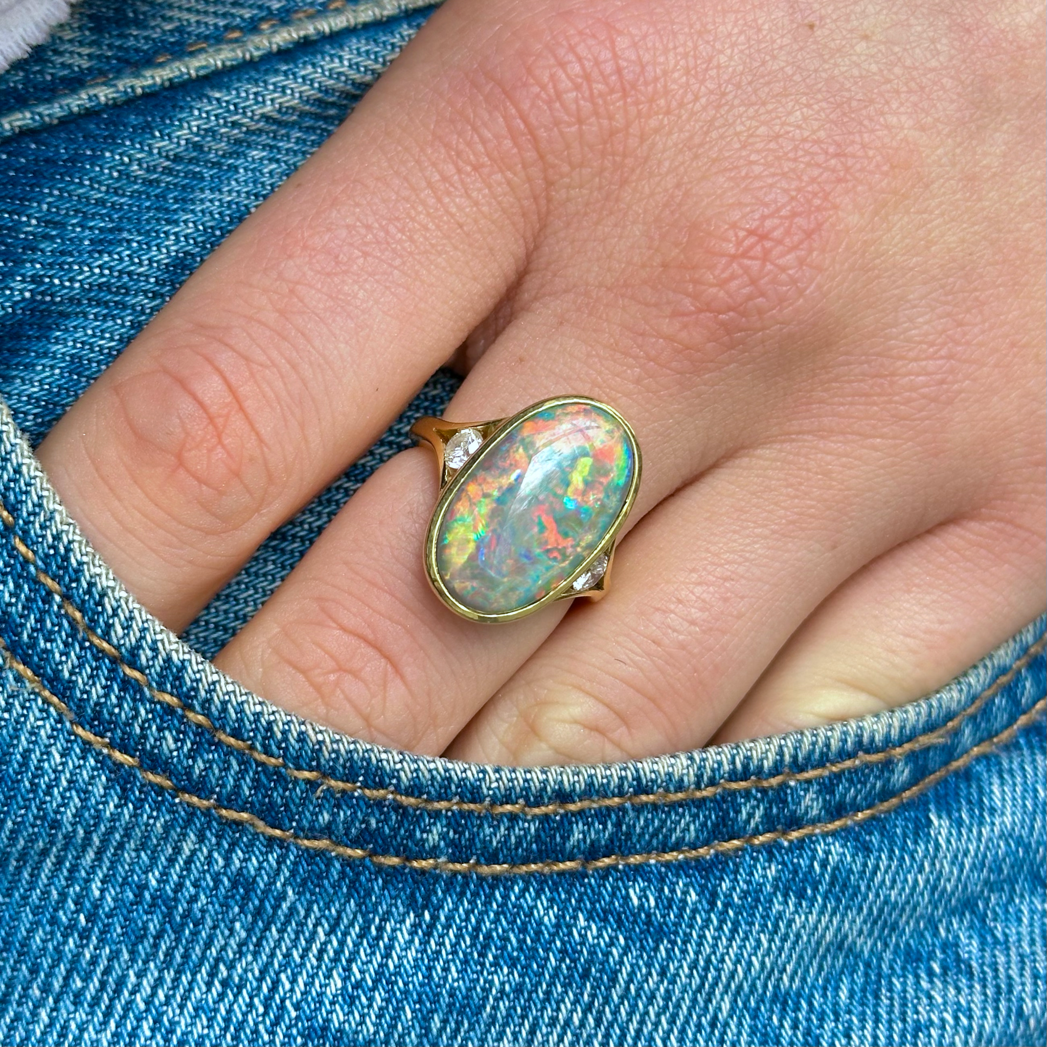 Contemporary, Black Opal and Diamond Cocktail Ring, worn on hand in pocket of jeans