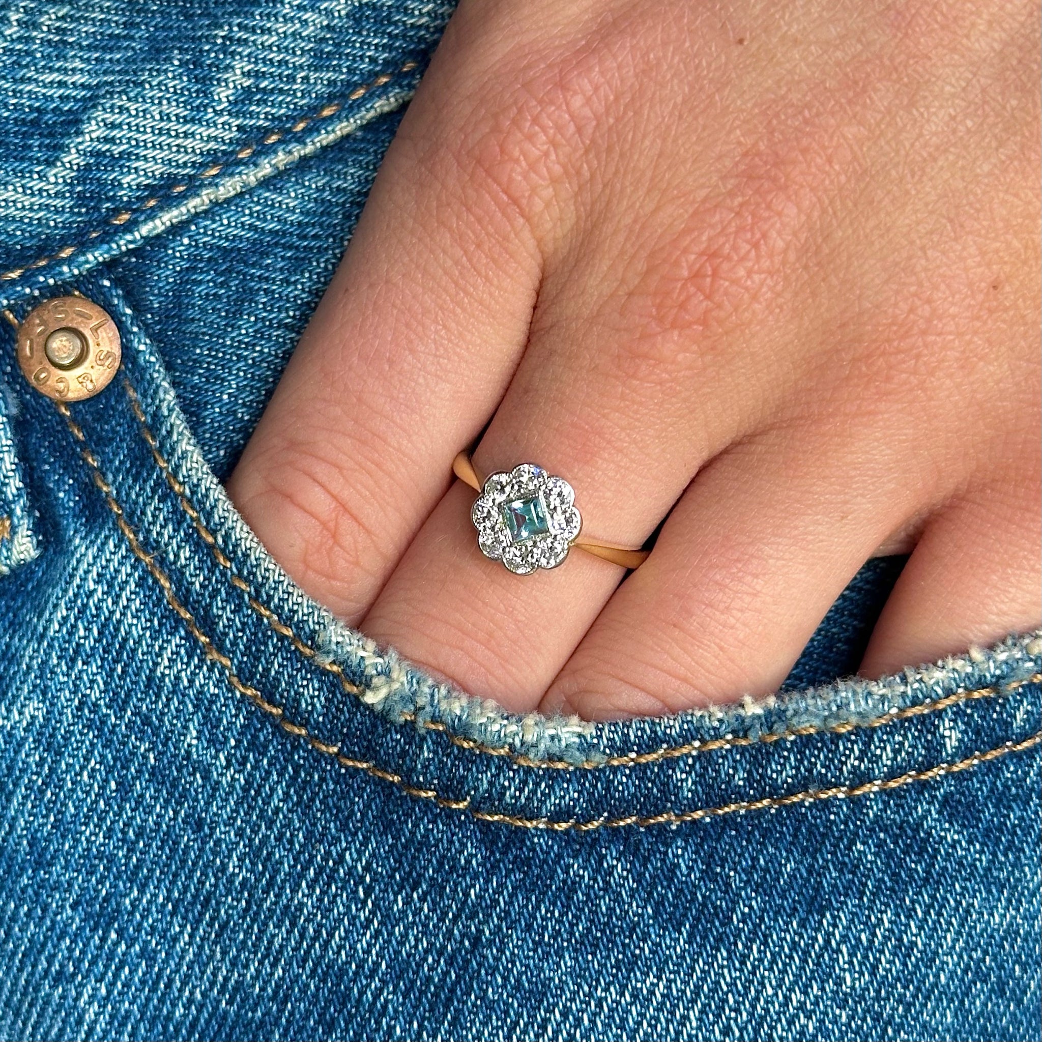 Edwardian aquamarine and diamond ring worn on hand in pocket of jeans