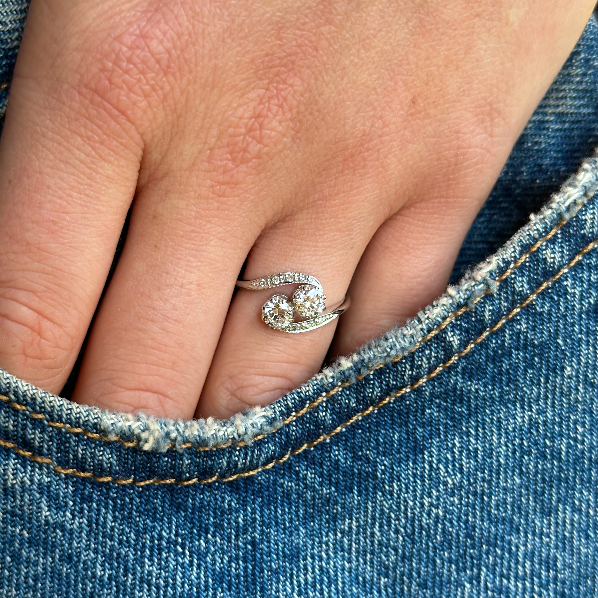 edwardian toi et moi ring worn on hand in pocket of jeans