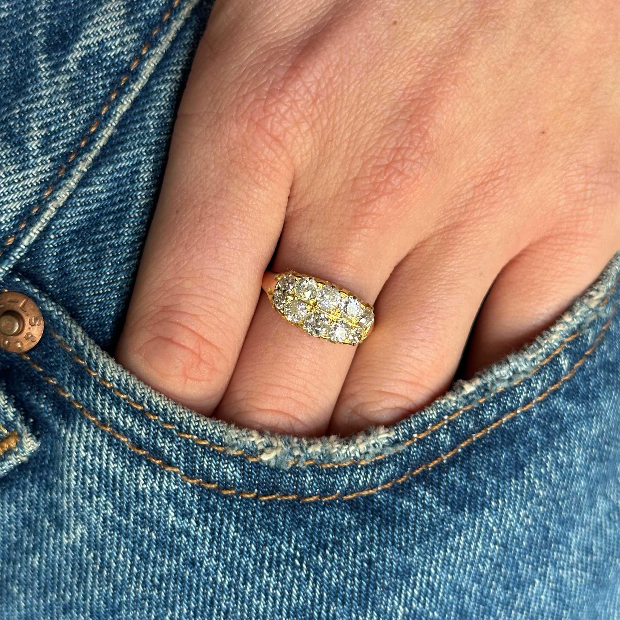 Victorian diamond ring worn on hand in pocket of jeans