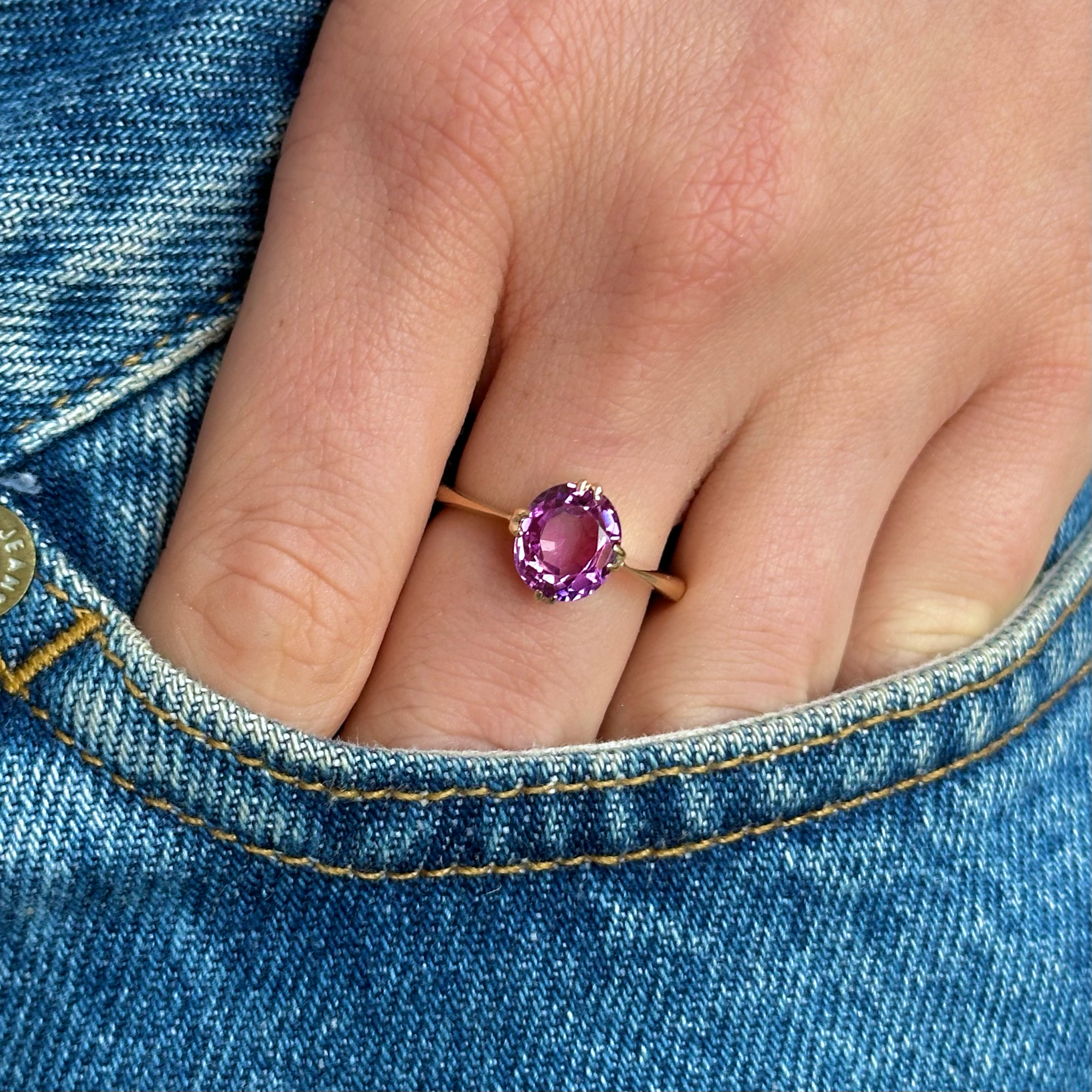 Vintage, 1940s Pink Sapphire Single-Stone Ring, worn on hand in pocket of jeans.
