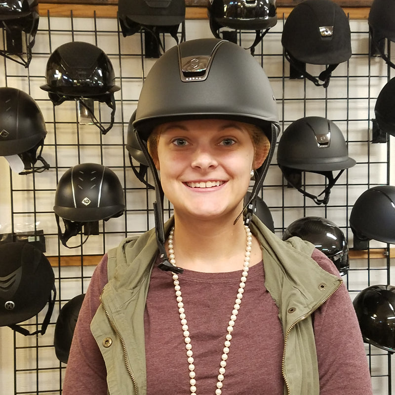 trying on a riding helmet