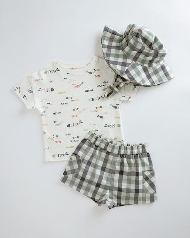 Flatlay image of printed Pehr Toddler T-Shirt with CheckMate Shorts and Bucket Hat