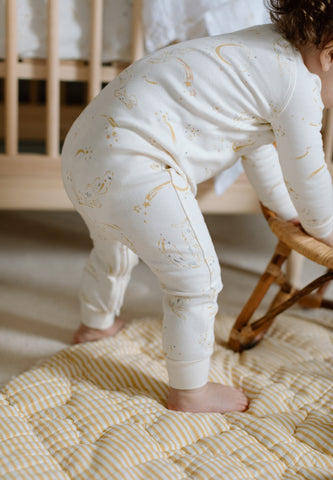 baby walking in footless sleeper