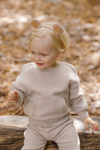 Image of a little boy in Teddy Fleece wearing homemade bear ears.