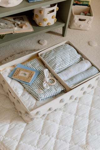 Pehr’s Hideaway Storage, packed with blankets, swaddles and other nursery essentials.