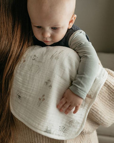 baby with burp cloth