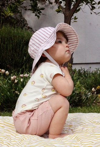 baby wearing bucket hat at picnic