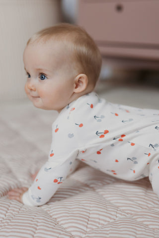 baby crawling in onesie