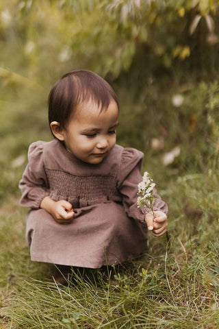 baby in fall dress outdoors