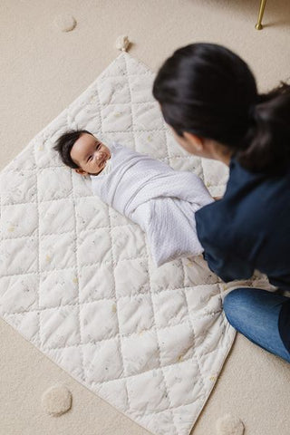 baby on play mat