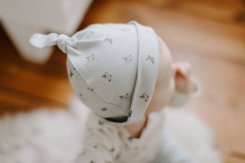 newborn baby wearing hat