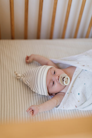 newborn in crib