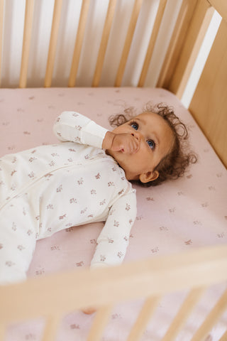 newborn in crib 