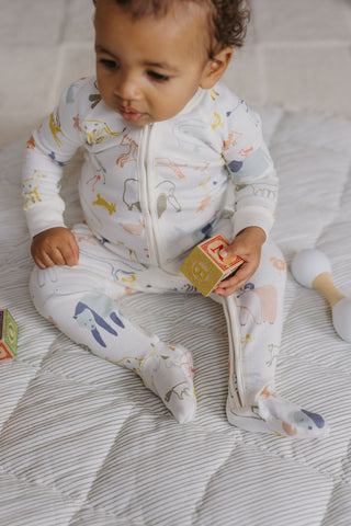 baby wearing covered feet pyjamas