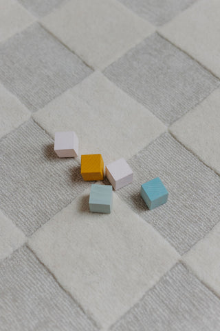 baby toy blocks on rug