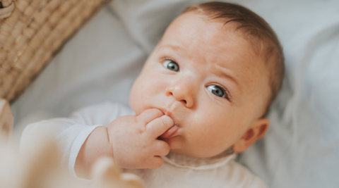 Image of baby sucking their hands