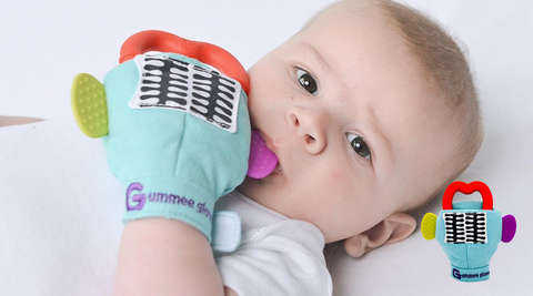 Photo of a baby chewing on a Gummee glove