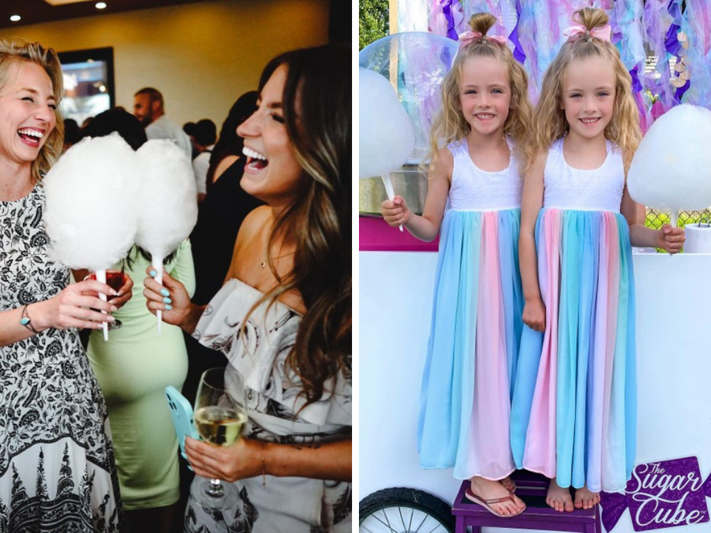 adults and children holding cotton candy puffs