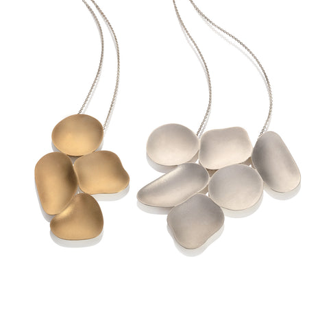 Juliet Strong, weathered shapes, gold and silver pendants