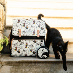 Vegan Leather Backpack featuring a Halloween Print next to a Black Cat