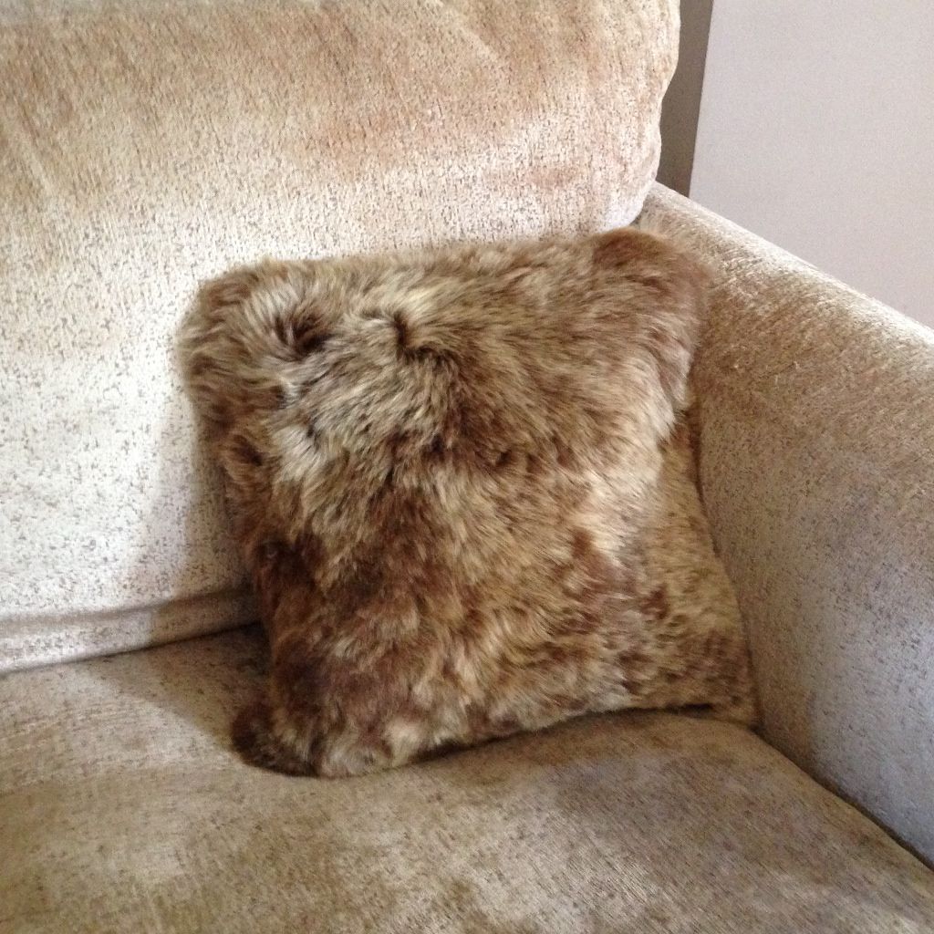 An image of Luxury Short Haired Sheepskin Cushion in Rusty Brown 35cm (Cotton Back)