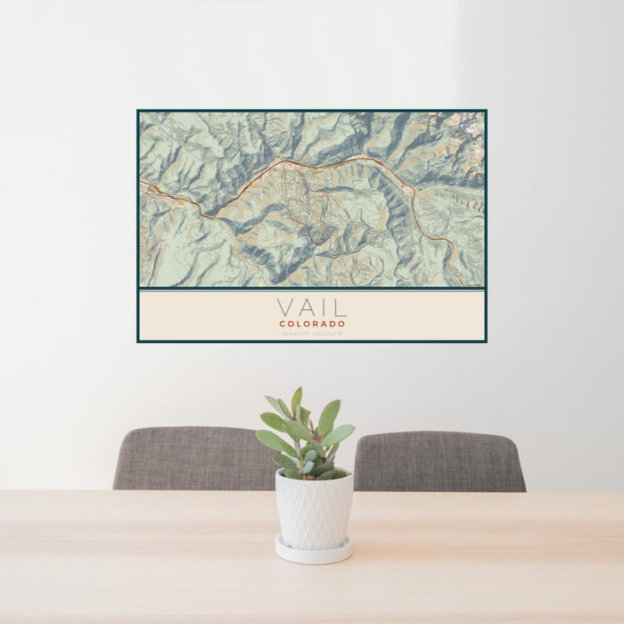 24x36 Vail Colorado Map Print Landscape Orientation in Woodblock Style Behind 2 Chairs Table and Potted Plant