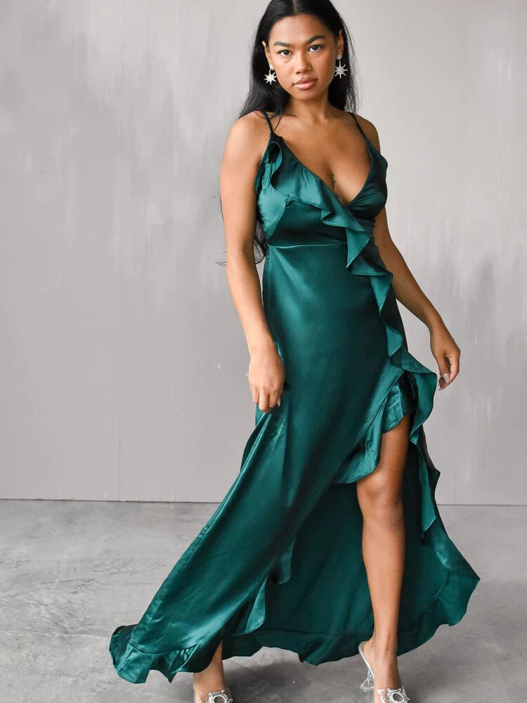 woman in an emerald maxi dress