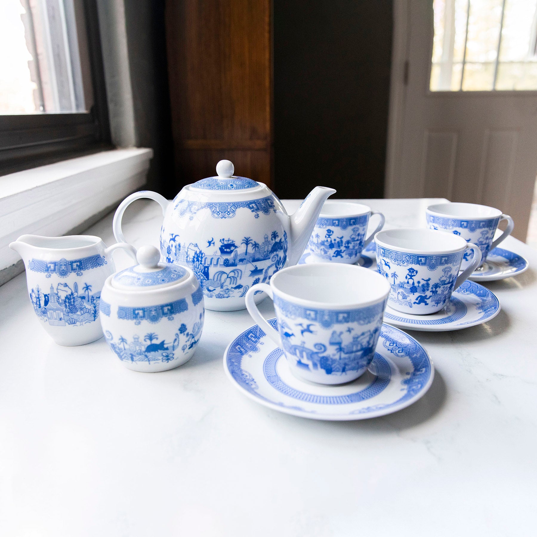 https://cdn.shopify.com/s/files/1/0311/1105/products/TeaSet_PotCreamSugar4teacups_188ac00b-6dba-4894-8156-7bb26583c2fc_2000x.jpg?v=1675215359