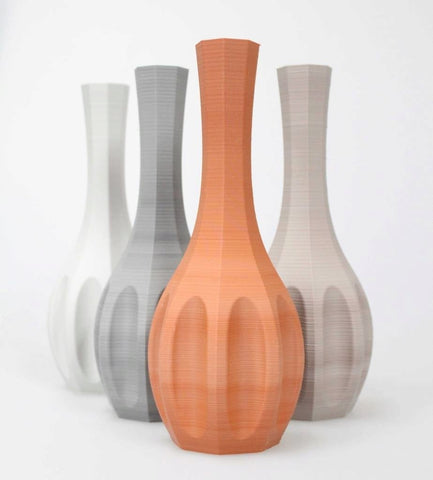 a group of 3d printed vases