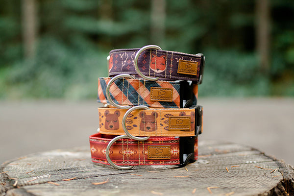 A beautiful stack of hand sewn dog collars featuring woodland animals from Gray and Hound