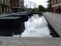 Water feature that has been constructed alongside some commercial buildings