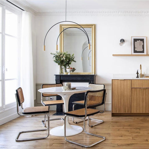 White room with wooden furniture.