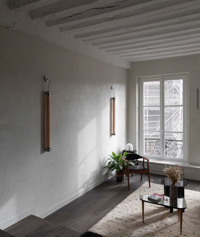 Room with white walls, french window and wood floors.