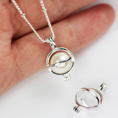 Pearl inside a silver cage pendant