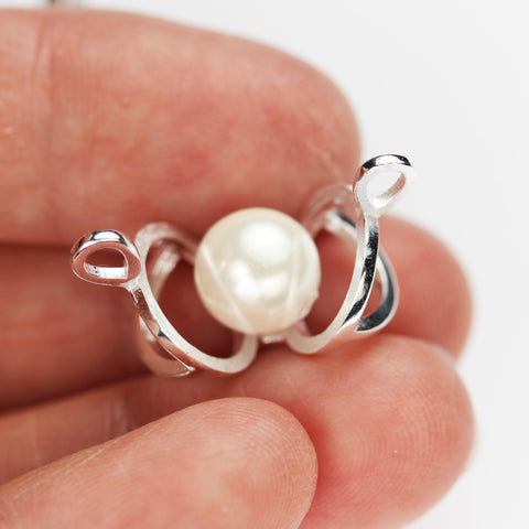 open locket pendant with pearl inside