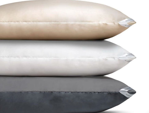 Close-up image of stacked pillows featuring our Dualsilk pillowcases, showcasing luxurious texture and elegance.