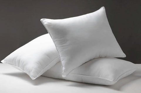 Stack of pillows, suggesting the need to replace your pillow.
