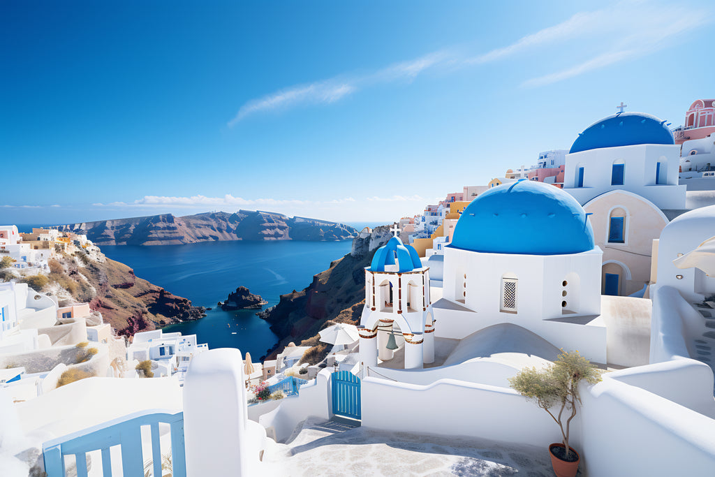 Santorini's iconic white buildings and blue domes overlooking the Mediterranean.