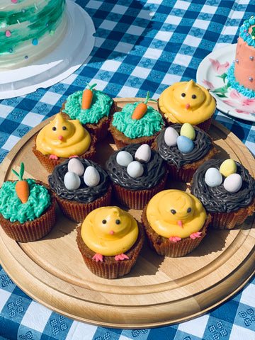 Bunny and duck cupcakes on wood tray