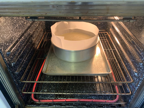 cake batter on pan in oven