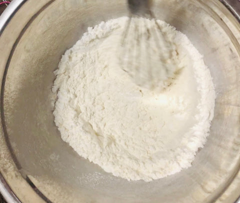 whisking flower in bowl