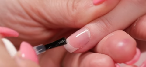 applying top coat after removing acrylic nails