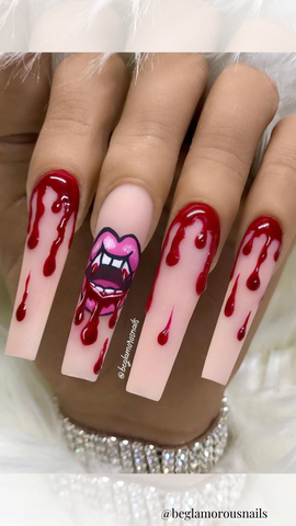 vampire fangs and blood on long acrylic nails